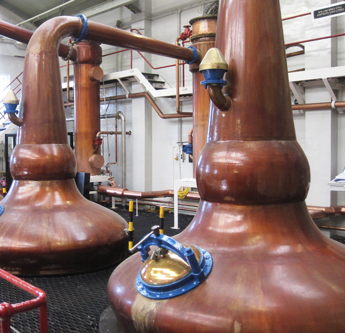 Photo of the inside of a whisky distillery
